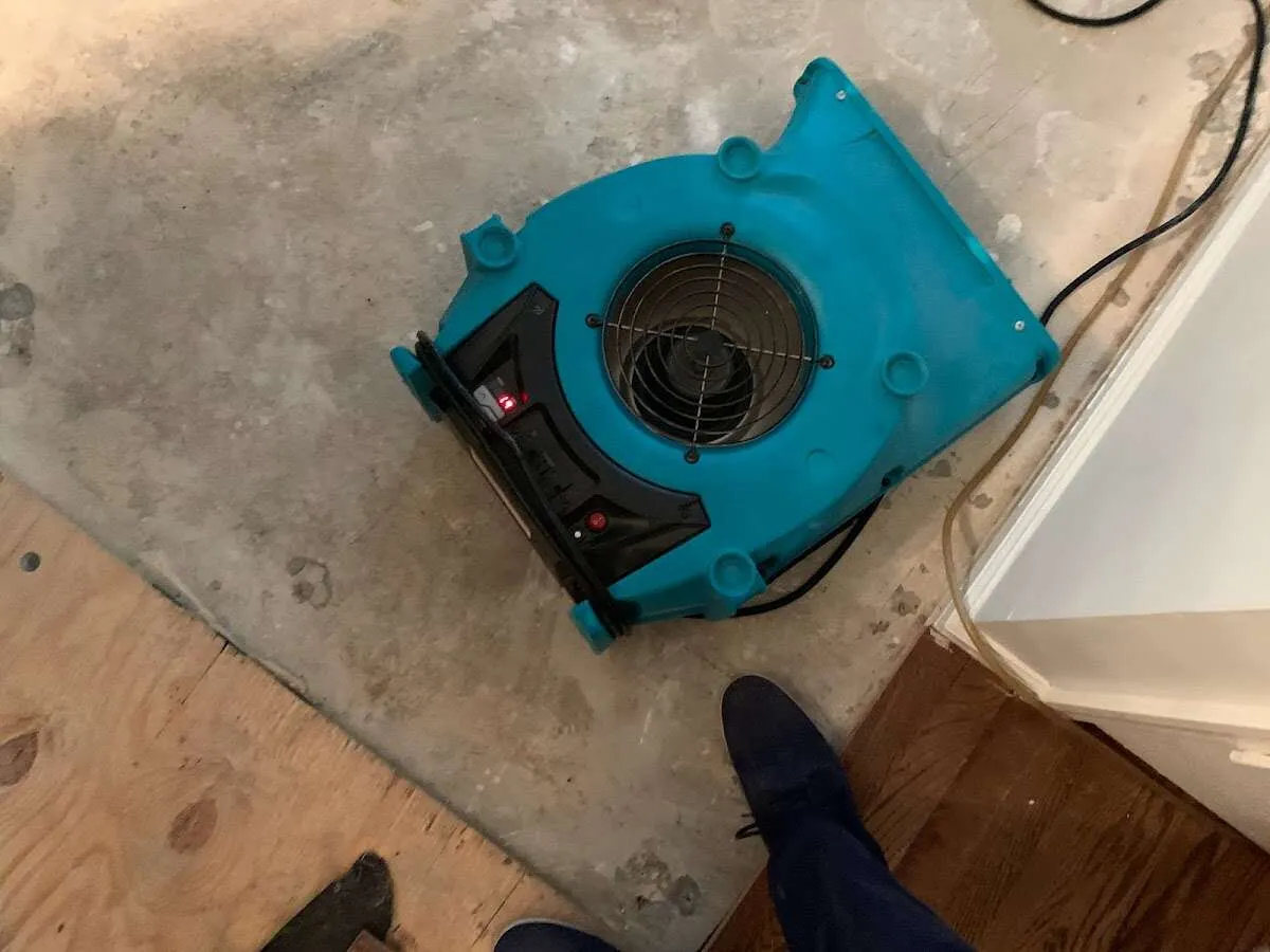 Air mover drying subfloor during Leak Detection & Repair in Spanish Fork